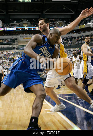 Orlando Magic forward Dwight Howard (12) loses the ball as he tries to drive past Indiana Pacers defender Jeff Foster (10) in the first half at Conseco Fieldhouse in Indianapolis, In April 19, 2006. (UPI Photo/Mark Cowan) Stock Photo