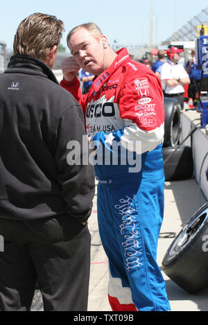 Two time Indy 500 winner Al Unser Jr, confers with his crew chief just prior to going out to practice at the Indianapolis Motor Speedway in Indianapolis, IN on May 19, 2006. Al came out of retirement to enter the 90th running of the Indianapolis 500.  (UPI Photo/ Ed Locke) Stock Photo