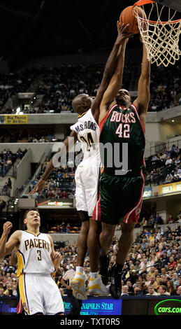 Indiana Pacers guard Darrell Armstrong (24) fouls Milwaukee Bucks guard Charlie Bell (42) as teammate Sarunas Jasikevicius (3) looks on at Conseco Fieldhouse in Indianapolis November 21, 2006. (UPI Photo/Mark Cowan) Stock Photo