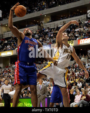 Detroit Pistons forward Rasheed Wallace (36) grabs a rebound in front of Indiana Pacers center Jeff Foster (10) at Conseco Fieldhouse in Indianapolis December 13, 2006. The Pacers defeated the Pistons 101-90. (UPI Photo/Mark Cowan) Stock Photo