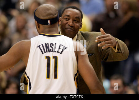 New York Knicks head coach Isiah Thomas hugs Indiana Pacers guard Jamal Tinsley (11) before their game at Conseco Fieldhouse in Indianapolis December 15, 2006. (UPI Photo/Mark Cowan) Stock Photo
