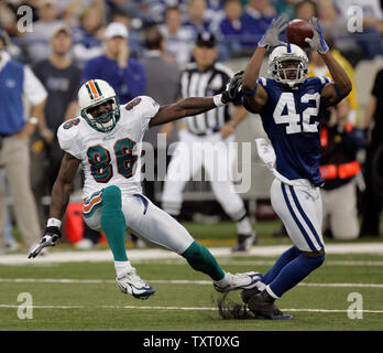 Indianapolis Colts defensive back Jason David (42) trips up Miami Dolphins wide receiver Marty Booker (86) as he breaks up a pass in the second half at the RCA Dome in Indianapolis on December 31, 2006. The Colts defeated the Dolphins 27-22. (UPI Photo/Mark Cowan) Stock Photo