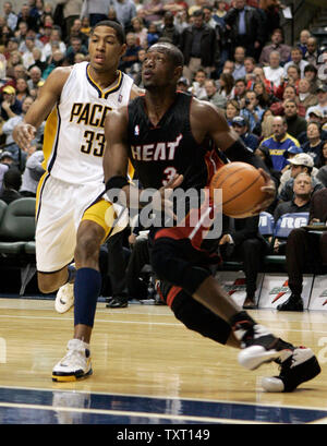 Miami Heat guard Dwyane Wade (3) drives past Indiana Pacers forward Danny Granger (33) at Conseco Fieldhouse in Indianapolis January 24, 2007. (UPI Photo/Mark Cowan) Stock Photo