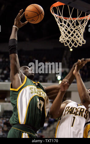 Seattle Supersonics center Johan Petro (27), from France, puts up a shot over Indiana Pacers forward Ike Diogu (1) at Conseco Fieldhouse in Indianapolis February 7, 2007. Seattle defeated Indiana 103-102. (UPI Photo/Mark Cowan) Stock Photo