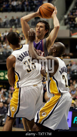 Phoenix Suns guard Steve Nash (13) looks to pass over Indiana Pacers defenders Danny Granger (33) and Darrell Armstrong (24) at Conseco Fieldhouse in Indianapolis February 27, 2007. (UPI Photo/Mark Cowan) Stock Photo