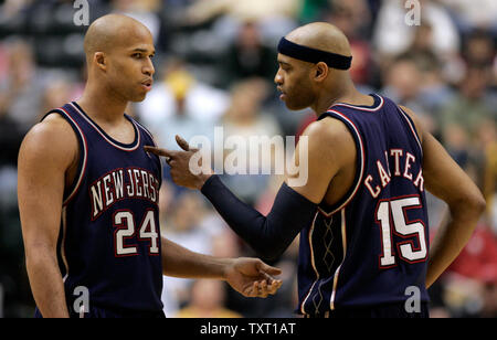 New Jersey Nets guard Vince Carter (15) gives forward Richard Jefferson (24) directions during the second half of their game against the Indiana Pacers at Conseco Fieldhouse in Indianapolis April 15, 2007. The Nets defeated the Pacers 111-107 pushing them to the brink of elimination from the playoffs.  (UPI Photo/Mark Cowan) Stock Photo
