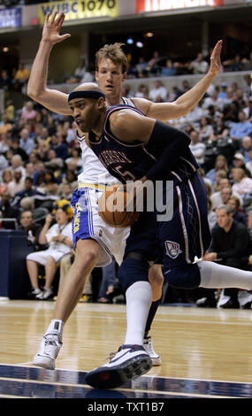 New Jersey Nets guard Vince Carter (15) goes up for a basket past Indiana Pacers guard Mike Dunleavy (L) at Conseco Fieldhouse in Indianapolis April 15, 2007. The Nets defeated the Pacers 111-107 pushing them to the brink of elimination from the playoffs.  (UPI Photo/Mark Cowan) Stock Photo