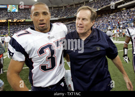 New England Patriots' Rodney Harrison (37) celebrates his fourth quarter  interception with teammate Randy Moss during New England's 31-20 win over  the Jacksonville Jaguars in a playoff football game at Gillette Stadium