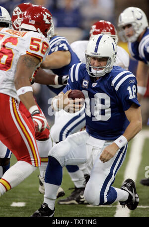 Indianapolis Colts quarterback slides before being sacked for a 6-yard loss by Kansas City Chiefs linebacker Derrick Johnson (56) during the second quarter at the RCA Dome in Indianapolis on November 18, 2007.  (UPI Photo/Mark Cowan) Stock Photo