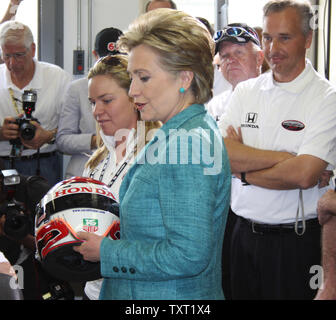 Indy 500 driver Sarah Fisher presents Hillary Clinton with one of her helmets as a souvenir on May 6, 2008 at the Indianapolis Motor Speedway in Indianapolis, Indiana. (UPI Photo/ Bill Coons) Stock Photo