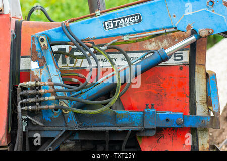 Close up of hydraulics of an old blue and red Massey Ferguson tractor Stock Photo