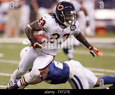 Chicago Bears kick returner Devin Hester (23) breaks the tackle of  Indianapolis Colts safety Matt Giordano (43) for a 92 yard touchdown on the  first play of Super Bowl XLI at Dolphin