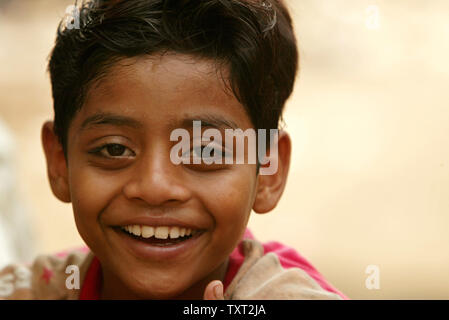 Indian Muslim and 'Slumdog Millionaire' child actor Mohammed Azharuddin Ismail smiles in a slum in East Bandra in Mumbai, India on March 16, 2009. (UPI Photo/Mohammad Kheirkhah) Stock Photo