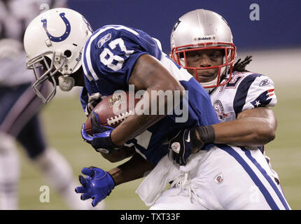 Indianapolis Colts wide receiver Reggie Wayne (87) is hit by New England Patriots cornerback Jonathan Wilhite (24) during the second quarter at Lucas Oil Field in Indianapolis on November 15, 2009.  UPI /Mark Cowan Stock Photo