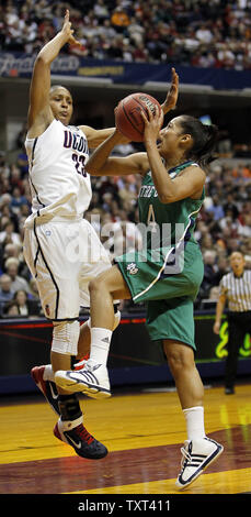 Notre Dame Fighting Irish guard Skylar Diggins (4) goes up for a basket against Connecticut Huskies forward Maya Moore (23) in the first half of their NCAA Women's Final Four game at Conseco Fieldhouse in Indianapolis on April 3, 2011.  UPI /Mark Cowan Stock Photo