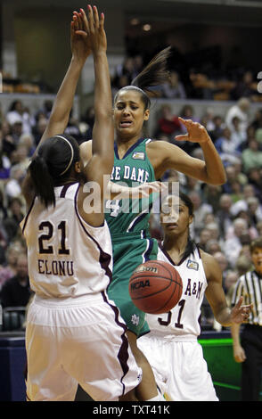 Notre Dame Fighting Irish guard Skylar Diggins (4) looses the ball as she collides with Texas A&M Aggies forward Adaora Elonu (21) in the NCAA Women's national championship game as teammate Sydney Colson (51) looks on at Conseco Fieldhouse in Indianapolis on April 5, 2011.  UPI /Mark Cowan Stock Photo