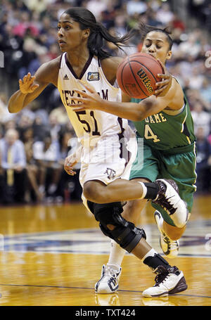 Notre Dame Fighting Irish guard Skylar Diggins (4) reaches around to try and knock the ball loose from Texas A&M Aggies guard Syndey Colson (51) in the second half of the Aggies 76-70 win in the NCAA Women's national championship game at Conseco Fieldhouse in Indianapolis on April 5, 2011.  UPI /Mark Cowan Stock Photo