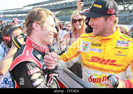 Ryan Hunter-Reay congratulates Ryan Briscoe for winning the pole for the 96th Indianapolis 500 on Pole Day May 19, 2012 in Indianapolis, Indiana.     UPI/Ed Locke Stock Photo