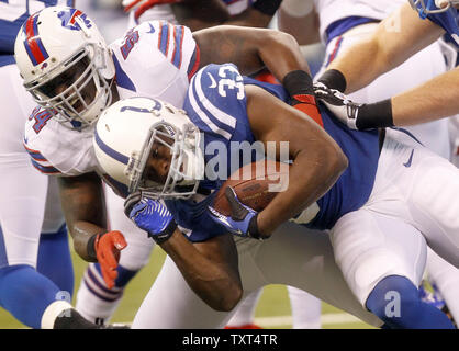 Indianapolis Colts running back Vick Ballard (33) is brought down by Buffalo Bills defensive end Kyle Moore (54) after a 3-yard run during the first quarter at Lucas Oil Stadium in Indianapolis, IN., November 25, 2012.  UPI /Mark Cowan Stock Photo