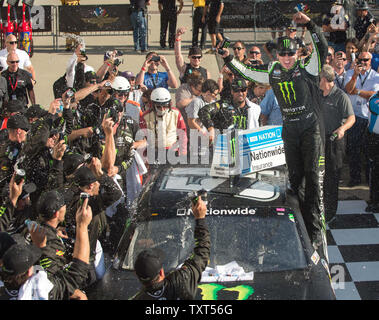 Kyle Busch celebrates with his crew after winning the 2nd annual Indiana 250, part of the NASCAR Nationwide Series, at the Indianapolis Motor Speedway in Indianapolis, on July 27, 2013.  UPI /Darrell Hoemann Stock Photo