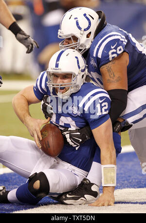 Indianapolis Colts quarterback Andrew Luck (12) scores a touchdown on a fumble behind guard Hugh Thornton (69) during the fourth quarter of their AFC Wild-Card Playoff game against the Kansas City Chiefs at Lucas Oil Field in Indianapolis on January 4, 2014.  The Colts came from a 28-point deficit to defeat the Chiefs 45-44. UPI /Mark Cowan Stock Photo