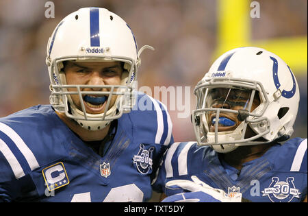 Indianapolis Colts quarterback Andrew Luck (12) greets Denver