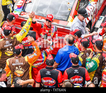 Kyle Busch celebrates with his crew after winning the Crown Royal presents the Jeff Kyle 400 at The Brickyard at Indianapolis Motor Speedway on July 26, 2015 in Indianapolis,In.    Photo by Tom Hayden/UPI Stock Photo