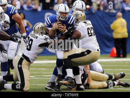 New Orleans Saints quarterback Bobby Hebert with his arm cocked back is  sacked by San Francisco 49ers defensive lineman Charles Haley during the  first quarter of their game at Candlestick Park in