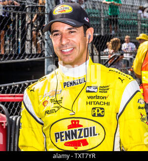 Three time Indy 500 winner Helio Castroneves walks to his car during opening day practice for the 102nd Indianapolis 500 at the Indianapolis Motor Speedway on May 15, 2018 in Indianapolis, Indiana.    Photo by Ed Locke/UPI Stock Photo