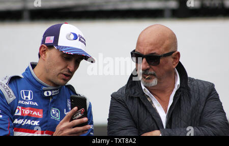 Former Indy 500 winner Bobby Rahal confers with his son and team Rahal - Letterman driver Graham Rahal during open test day for the 103rd running of the Indianapolis 500 at the Indianapolis Motor Speedway on April 24, 2019 in Indianapolis, Indiana. Rahal won the 500 in 1986.    Photo by Bill Coons/UPI Stock Photo