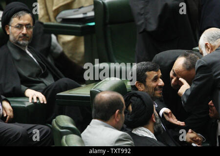 Iranian President Mahmoud Ahmadinejad, on the right-center, talks with lawmakers of parliament to discuss three Cabinets' minister nominees, in Tehran, Iran, on November 15, 2009.     UPI/Maryam Rahmanian Stock Photo