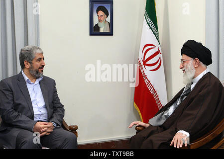 Iran's Supreme Leader Ayatollah Ali Khamenei (R) speaks with  Hamas leader Khaled Meshaal  during an official meeting in Tehran, Iran on December 15, 2009.     UPI Stock Photo