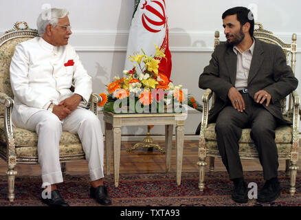 Iranian President Mahmoud Ahmadinejad, right, talks with Indian Foreign Minister Natwar Singh, during their official meeting in Tehran, Iran, Saturday, September 3, 2005.(UPI Photo/Mohammad Kheirkhah) Stock Photo