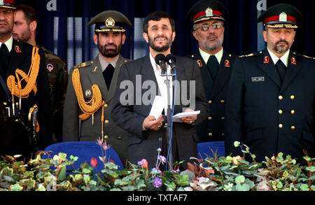 Iran's president Mahmoud Ahmadinejad (C) delivers his speech for Iranian police students during graduation ceremony in Tehran on October 6, 2005.  Brigadier General Esmail Ahmadi-Moqaddam stands at right.  (UPI Photo/Mohammad Kheirkhah) Stock Photo