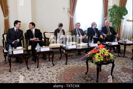 (Lto R) Switzerland and China Ambassador to Iran, British Charge d'Affairs to Tehran Kate Smith, French Ambassador to Iran Bernard Poletti, Russian Ambassador Alexander Tadounilacov and German Ambassador to Iran H.E.Baron Paul wait for Iran's chief nuclear negotiator Ali Larijani (not shown) to begin their meeting in Tehran, Iran  on August 22, 2006. Iran's chief nuclear negotiator says the country will not accept conditions for beginning international incentive talks on its nuclear program. (UPI Photo/Amir Kholoosi/ISNA) Stock Photo