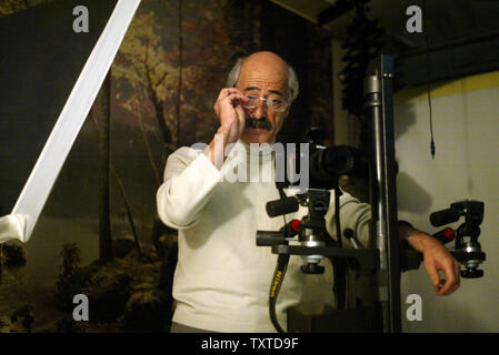 Jahangir Razmi, 57, is shown in his photo studio in Tehran on December 4, 2006.  It has now been confirmed that he was the photographer who anonymously won a Pulitzer Prize for an image of the execution of eleven alleged enemies of the Iranian revolution in Sanandaj, Iran on August 27, 1979. The image was distributed worldwide by United Press International Newspictures (UPI).   Razmi worked for the newspaper Ettela'at at the time. The image was taken with a Nikon FE Camera and Nikkor 28mm lens using Kodak ASA 400 Tri-X film.  (UPI Photo/Mohammad Kheirkhah) Stock Photo