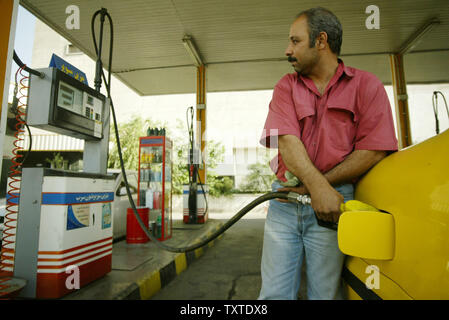 An Iranian driver fuels his car at a gas station in Tehran, Iran on May 23, 2007.  Iran increased the price of gasoline by 25 percent Tuesday, trying to reduce subsidies in a decision likely to deepen dissatisfaction with the government of hard-line President Mahmoud Ahmadinejad.  The price was raised to 38 cents from 30 cents a gallon.  The average price in the United States at this time is approximately $3.18.  (UPI Photo/Mohammad Kheirkhah) Stock Photo