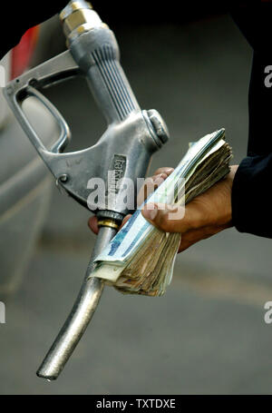 An Iranian driver fuels his car at a gas station in Tehran, Iran on May 24, 2007. Iran increased the price of gasoline by 25 percent Tuesday, trying to reduce subsidies in a decision likely to deepen dissatisfaction with the government of hard-line President Mahmoud Ahmadinejad. The price was raised to 38 cents from 30 cents a gallon. The average price in the United States at this time is approximately $3.18. (UPI Photo/Mohammad Kheirkhah) Stock Photo