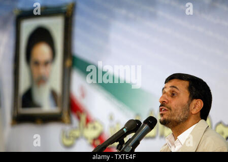 Iran's President Mahmoud Ahmadinejad speaks in front of a pictures of late revolutionary founder Ayatollah Khomeini to mark the 'International Day Against Drug Abuse and Illicit Trafficking' in Tehran, Iran on June 26, 2007. (UPI Photo/Mohammad Kheirkhah) Stock Photo