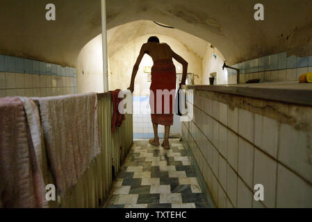 Iranian men prepare to take a bath in a traditional bath known as Hamam e Shah in Qazvin province 91 Miles 165 Km west of Tehran Iran on September 27 2007. The bath is over 700 years old and costs les...