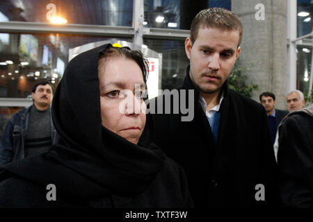 Christine Levinson (L), wife of an ex-FBI agent Robert Levinson who disappeared in Iran in March 2007, and her son Daniel (R) are seen after arriving at Imam Khomeini International Airport in Tehran, Iran on December 18, 2007. Robert Levinson went missing while on a business trip to Iran's southern island of Kish and the Iranian government claims they have no information on his whereabouts.  (UPI Photo) Stock Photo