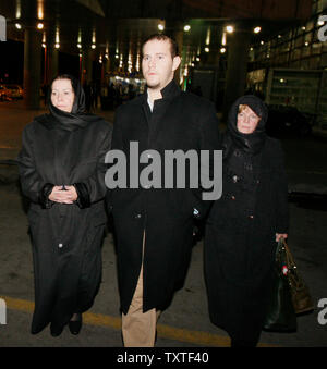 Christine Levinson (L), wife of an ex-FBI agent Robert Levinson who disappeared in Iran in March 2007, her son Daniel (C), and her sister Susan are seen after arriving at Imam Khomeini International Airport in Tehran, Iran on December 18, 2007. Robert Levinson went missing while on a business trip to Iran's southern island of Kish and the Iranian government claims they have no information on his whereabouts. (UPI Photo) Stock Photo