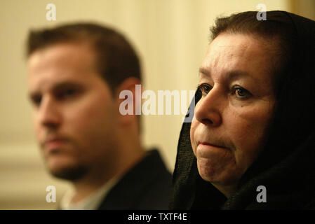 Christine Levinson (R), wife of ex-FBI agent Robert Levinson who disappeared in Iran in March 2007, and her son Daniel (L) attend a press conference at the Swiss embassy in Tehran, Iran on December 22, 2007. Robert Levinson went missing while on a business trip to Iran's southern island of Kish and the Iranian government claims they have no information on his whereabouts. (UPI Photo/Mohammad Kheirkhah) Stock Photo