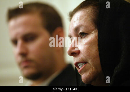 Christine Levinson (R), wife of ex-FBI agent Robert Levinson who disappeared in Iran in March 2007, speaks as her son Daniel (L) listens during a press conference at the Swiss embassy in Tehran, Iran on December 22, 2007. Robert Levinson went missing while on a business trip to Iran's southern island of Kish and the Iranian government claims they have no information on his whereabouts. (UPI Photo/Mohammad Kheirkhah) Stock Photo