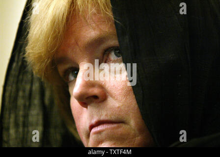 Susan, sister of Christine Levinson (not shown), wife of ex-FBI agent Robert Levinson who disappeared in Iran in March 2007, listens during a press conference at the Swiss embassy in Tehran, Iran on December 22, 2007. Robert Levinson went missing while on a business trip to Iran's southern island of Kish and the Iranian government claims they have no information on his whereabouts. (UPI Photo/Mohammad Kheirkhah) Stock Photo