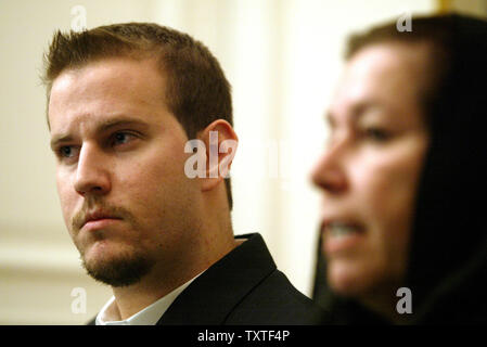 Christine Levinson (R), wife of ex-FBI agent Robert Levinson who disappeared in Iran in March 2007, speaks to the media as her son Daniel (L) looks on during a press conference at the Swiss embassy in Tehran, Iran on December 22, 2007. Robert Levinson went missing while on a business trip to Iran's southern island of Kish and the Iranian government claims they have no information on his whereabouts. (UPI Photo/Mohammad Kheirkhah) Stock Photo