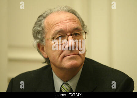 Swiss ambassador to Tehran Philippe Welti listens to Christine Levinson (not shown), wife of ex-FBI agent Robert Levinson who disappeared in Iran in March 2007, while she speaks to the media during a press conference at the Swiss embassy in Tehran, Iran on December 22, 2007. Robert Levinson went missing while on a business trip to Iran's southern island of Kish and the Iranian government claims they have no information on his whereabouts. (UPI Photo/Mohammad Kheirkhah) Stock Photo