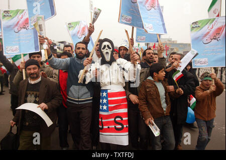 Iranians hold placards as they attend a rally marking the 29th anniversary of Iran's Islamic Revolution at the Azadi (freedom) Square in Tehran, Iran on February 11, 2008. (UPI Photo/Mohammad Kheirkhah) Stock Photo