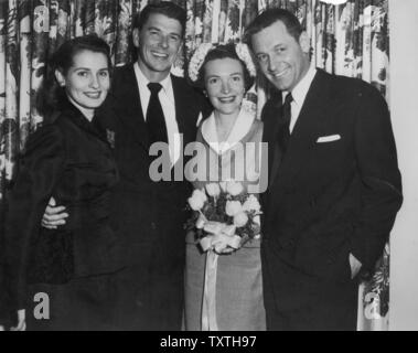 RONALD REGAN and wife Nancy on their wedding day 1 January 1952. William Holden at right was Best Man and  Maid of Honour was Phillipine-born actress Brenda Marshall.  Photo: White House Stock Photo