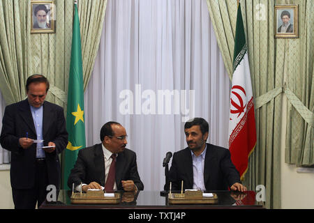 Iranian President Mahmoud Ahmadinejad (R) speaks with Mauritanian President Mohamed Ould Abdel Aziz during their press conference at the presidential place in Tehran,Iran on January 26,2010.     UPI/Maryam Rahmanian Stock Photo